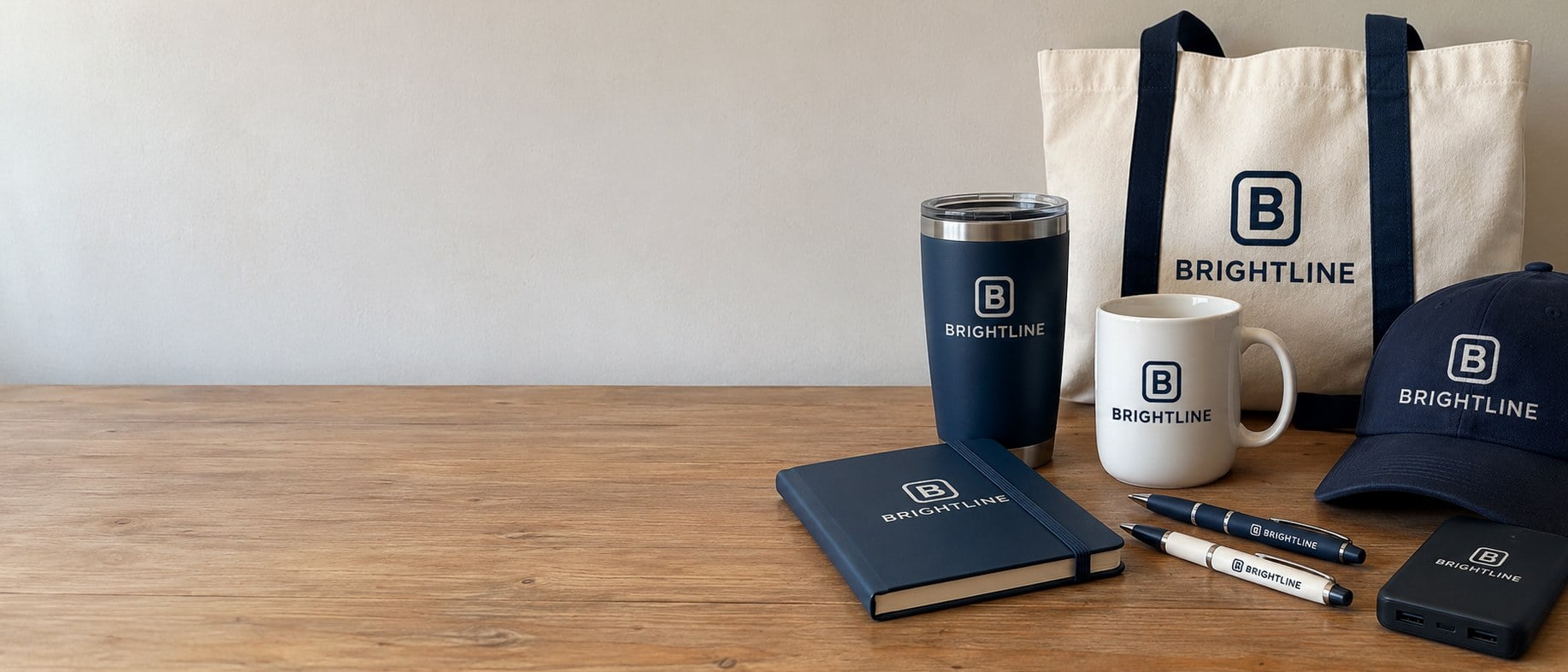 Custom promotional products with a company logo arranged on a table